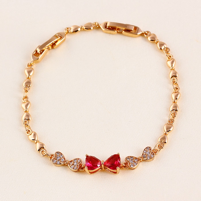 สร้อยข้อมือทองสีชมพู 18k Rose Gold Filled ประดับเพชร CZ ดีไซน์รูปโบว์สีแดงทับทิม สร้อยข้อมือทองสีชมพู 18k Rose Gold Filled ประดับเพชร CZ ดีไซน์รูปโบว์สีแดงทับทิม